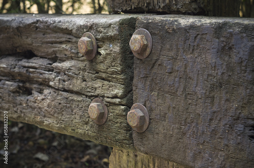 Closeup of decayed worn wooden fence - decaying wooden texture with shollow DOF photo