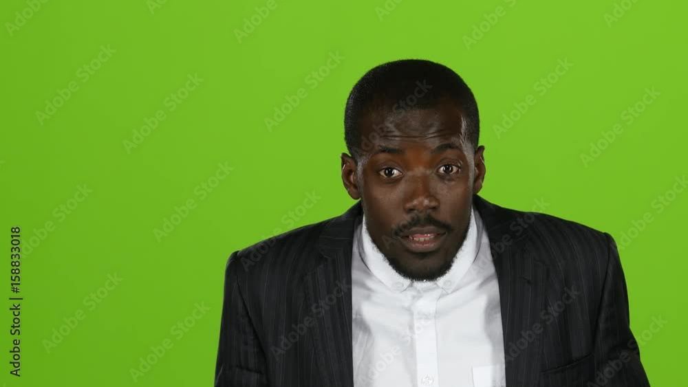 African american is indignant, he is angry and aggressive. Green screen. Slow motion. Close up African american is indignant, he is angry and aggressive. Green screen. Slow motion. Close up