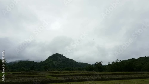 time lapse clouds on the mountains before raining photo