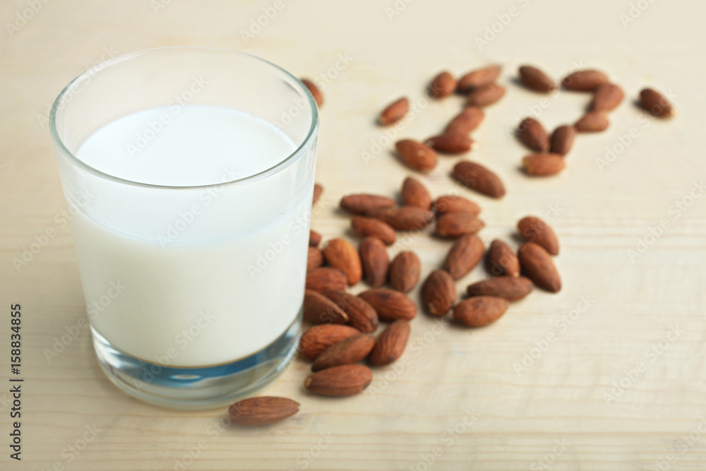 Glass of milk and almonds Glass of milk and almonds