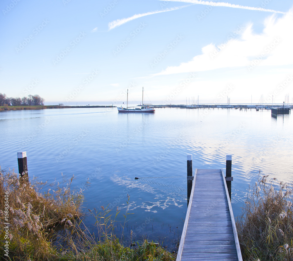 View at jetty with boat and lake in Enkhuizen, The Netherlands