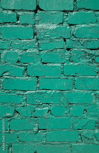 old brick wall painted in green color