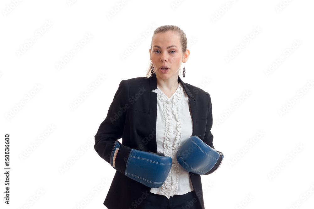 young beautiful blonde surprised stands in costume and boxing gloves and opened her mouth young beautiful blonde surprised stands in costume and boxing gloves and opened her mouth