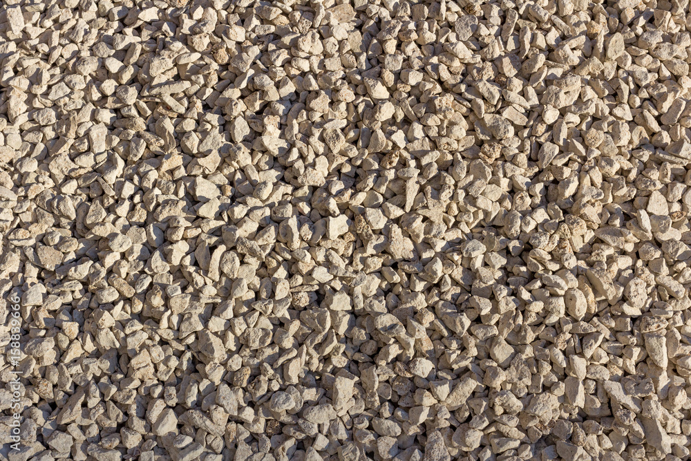 Naklejka premium Beige coarse gravel.