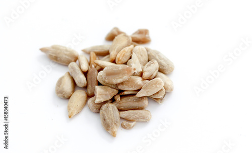 Natural shelled sunflower seeds on white background