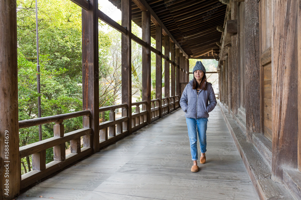 Woman walking in japanese old house