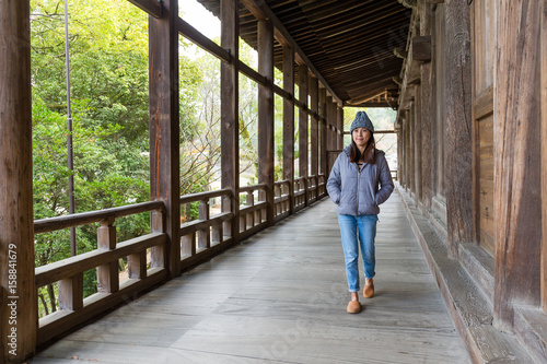 Woman walking in japanese old house