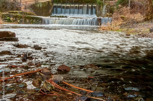 Vaives old mill dam on the river photo