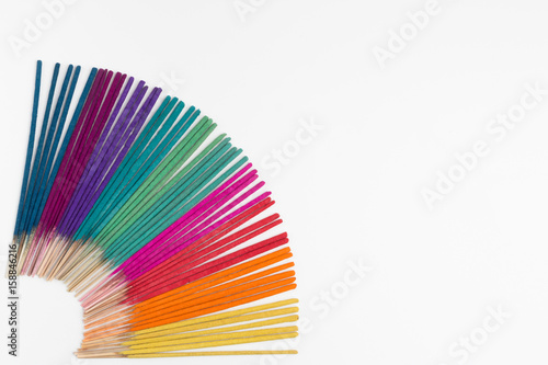 Colorful incense on white background.