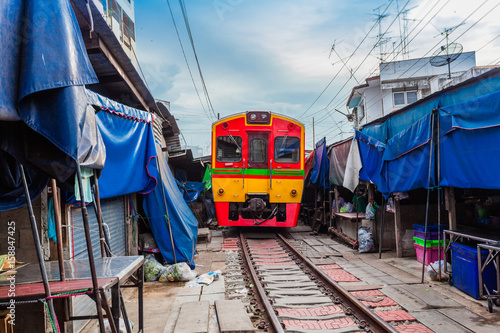 the train pass inside the fresh market © Narong Niemhom
