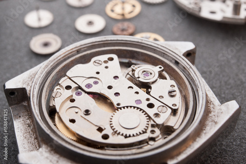 Detail of watch machinery on the table.