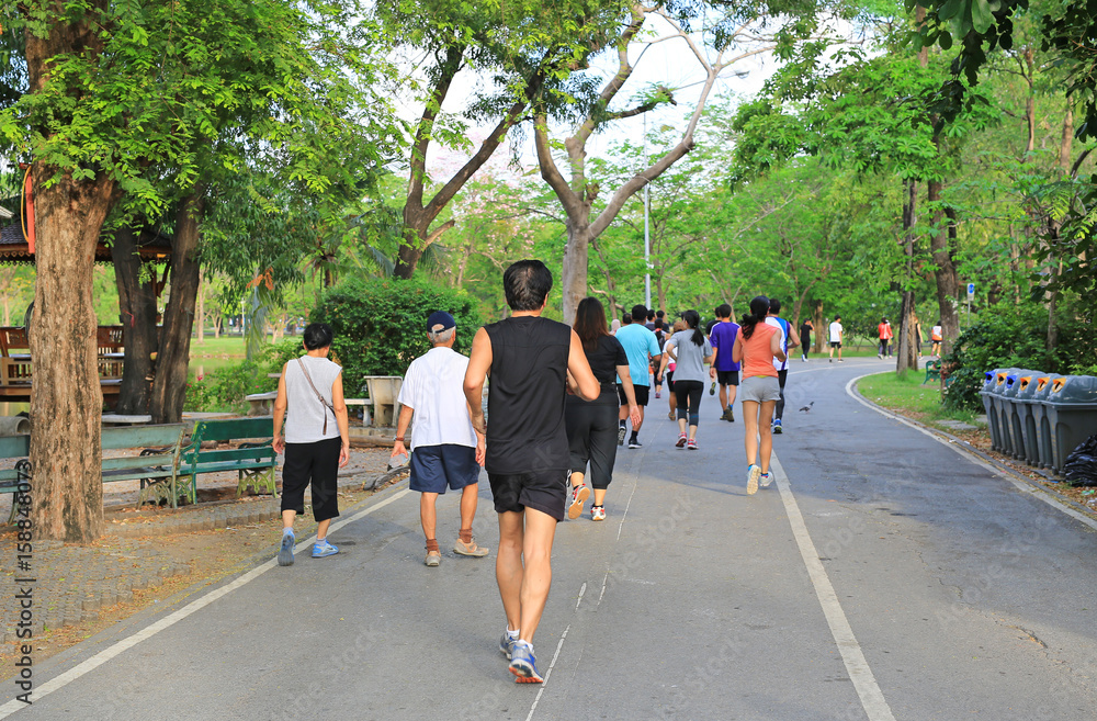 Group of people running in Park. rear view.