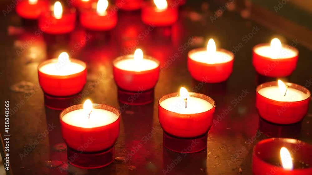 Burning candles for promise payment in catholic-church worship Burning candles for promise payment in catholic-church worship