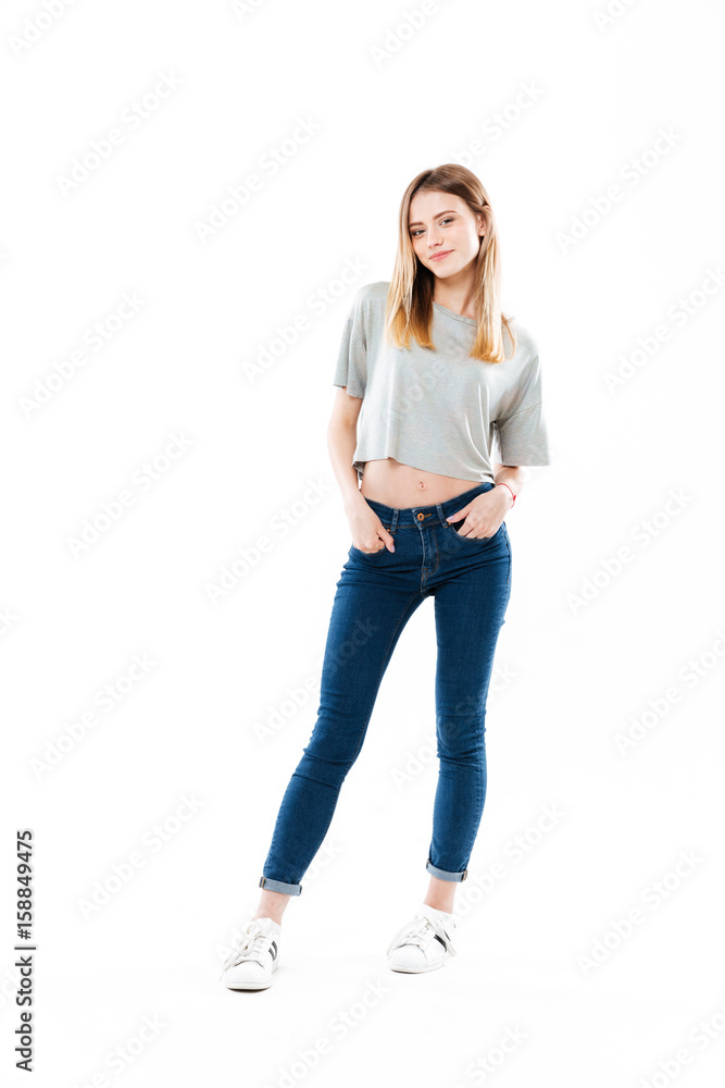 Smiling happy girl standing and looking at camera Smiling happy girl standing and looking at camera