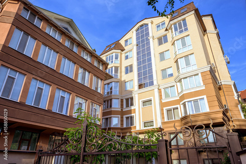 Apartment house building at zaikin street in chisinau centre, blue sky at sunset, moldova