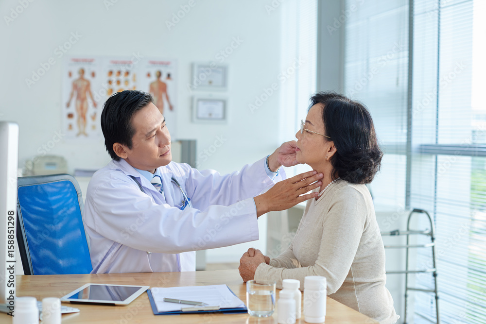 Fototapeta premium ENT Specialist Examining Patient