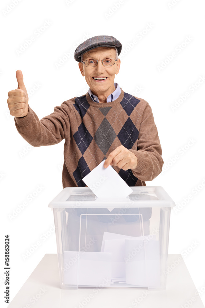 Senior voting and making a thumb up gesture Senior voting and making a thumb up gesture