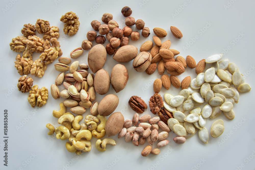 Variety of nuts/The variety of nuts used in gastronomy. From left to right and top to bottom: walnut, pistachios, cashews, hazelnuts, Indian pecans, peanuts, almonds, pumpkin seeds Variety of nuts/The variety of nuts used in gastronomy. From left to right and top to bottom: walnut, pistachios, cashews, hazelnuts, Indian pecans, peanuts, almonds, pumpkin seeds