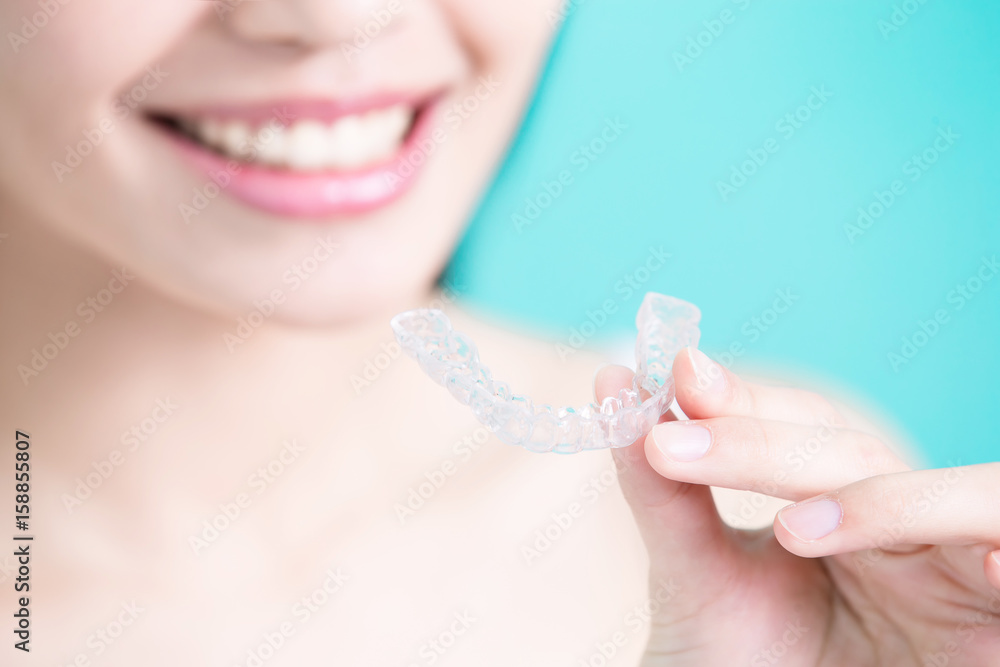 woman take invisible braces woman take invisible braces
