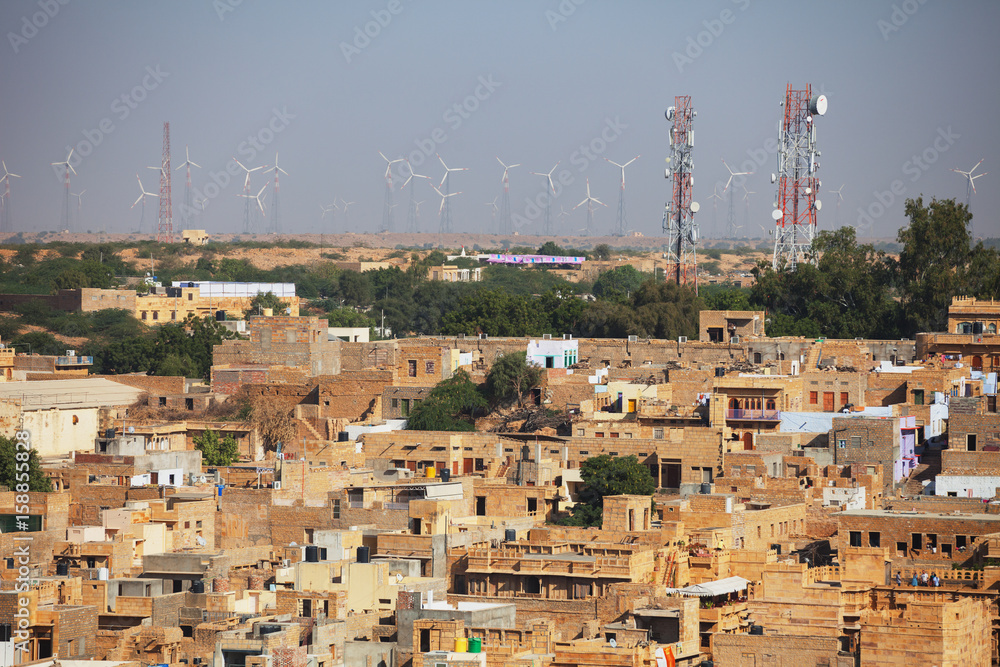 Jaisalmer, India. Streets with cell towers and wind power generators