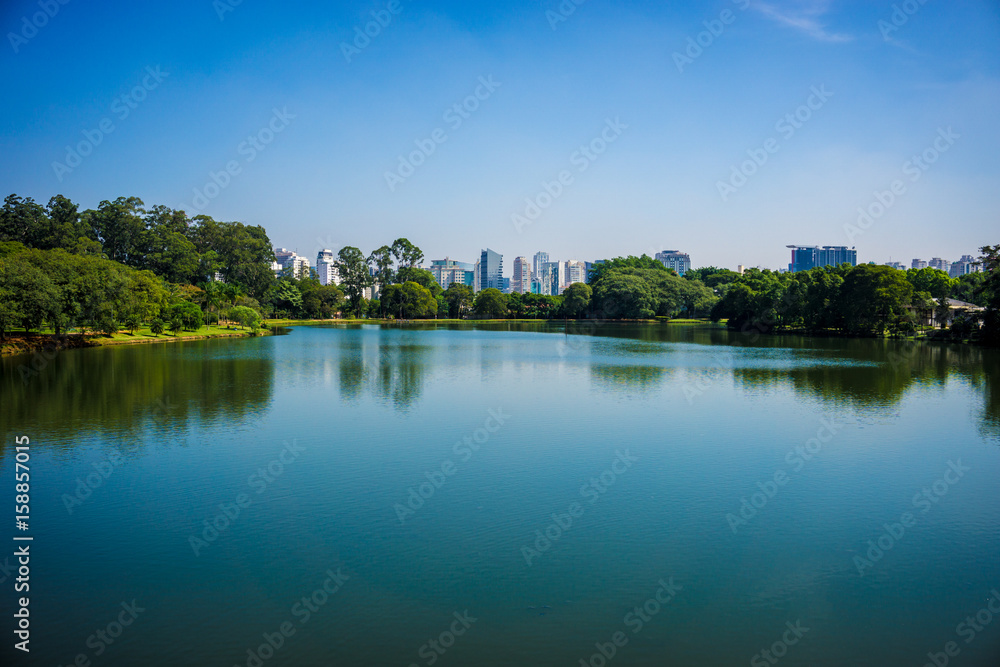 Ibirapuera Park, Sao Paulo, Brazil - Panoramic view of the lake with buildings in the background.