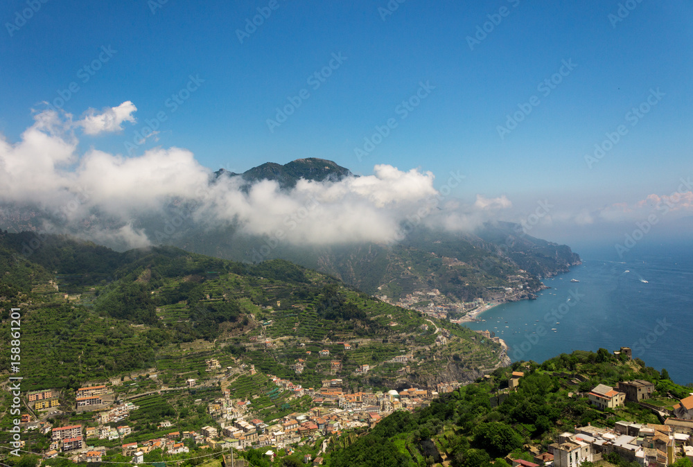 View from the hill of Ravello with mountain, clouds and sea coast of Amalfi, Italy