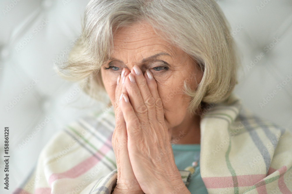 Beautiful sad elderly woman close-up