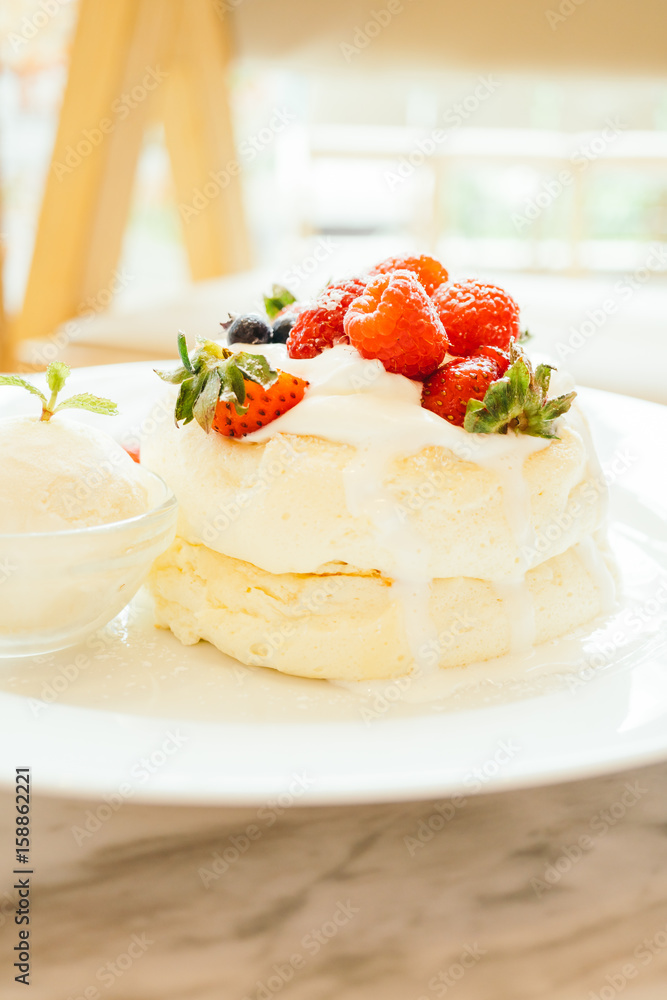 Pancake with ice cream strawberry , blueberry and raspberry Pancake with ice cream strawberry , blueberry and raspberry