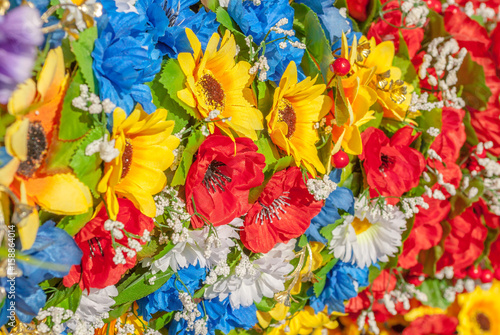 multicolor artificial flowers, made of fabric, background, focus selection © uvisni