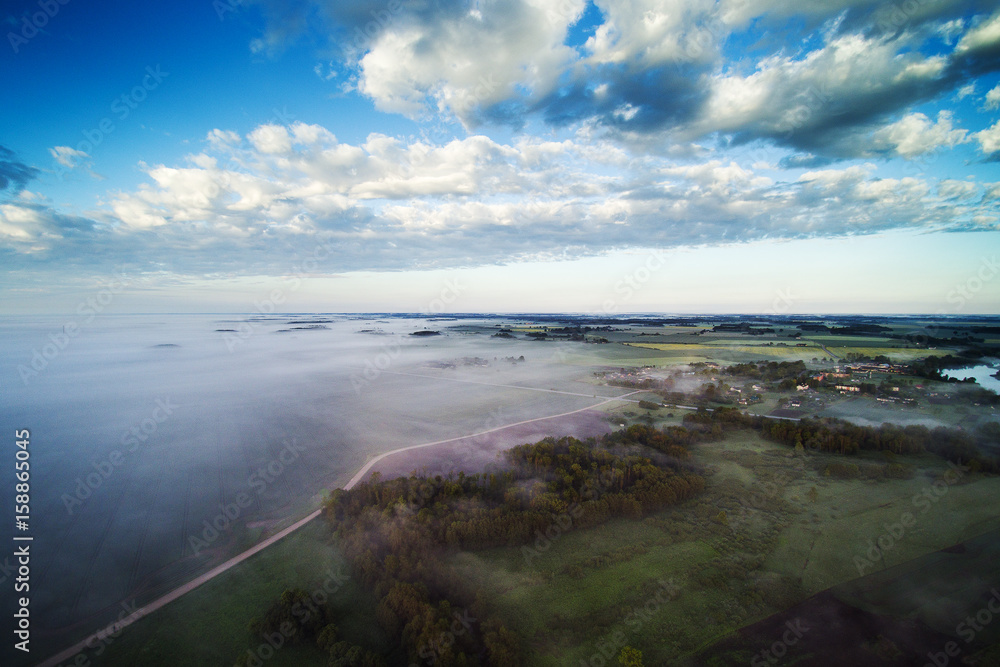 Foggy morning in countryside, Latvia.