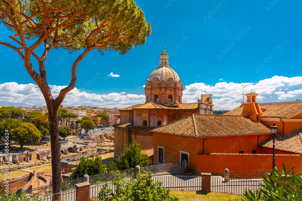 Obraz premium The Baroque church of Santi Luca e Martina with the remains of the Roman Forum in the sunny day in Rome, Italy