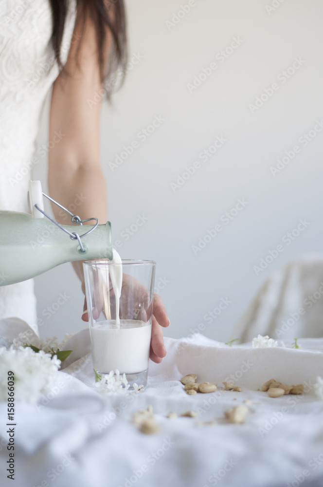 Pouring Raw Vegan Cashew Milk Pouring Raw Vegan Cashew Milk