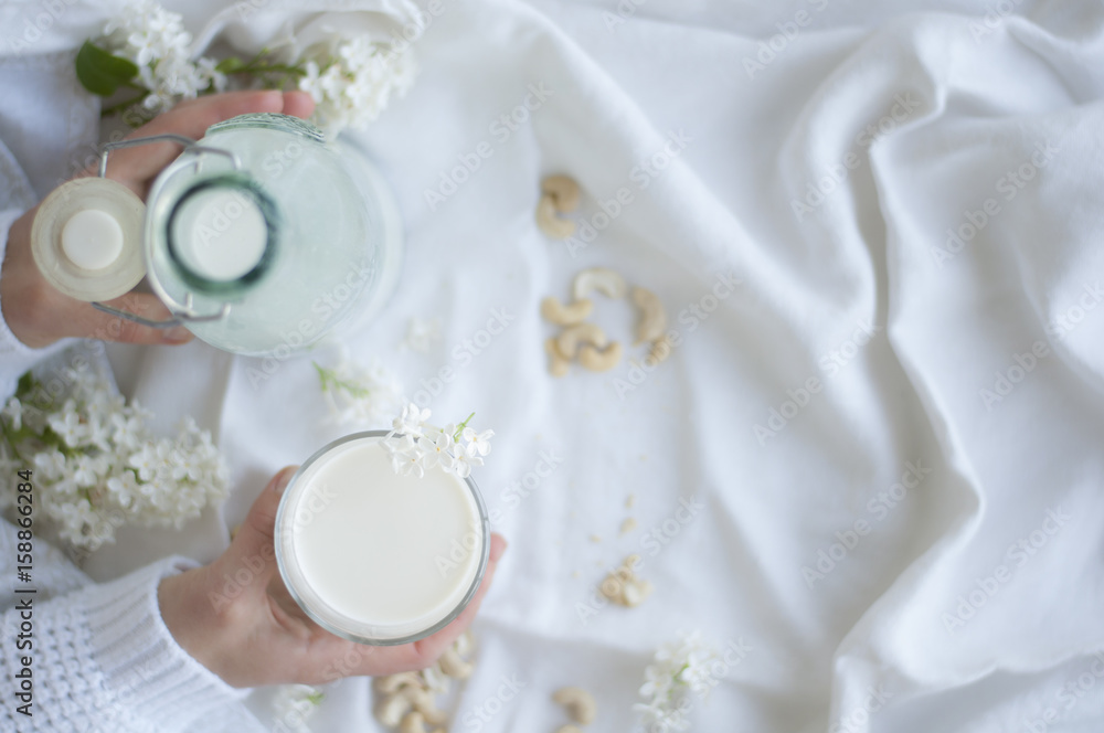 Holding Raw Vegan Cashew Milk