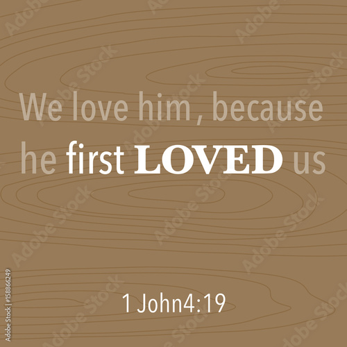 bible quote typographic for printing t-shirt or using in poster, we love him, because he first loved us on wooden background from 1 John4:19