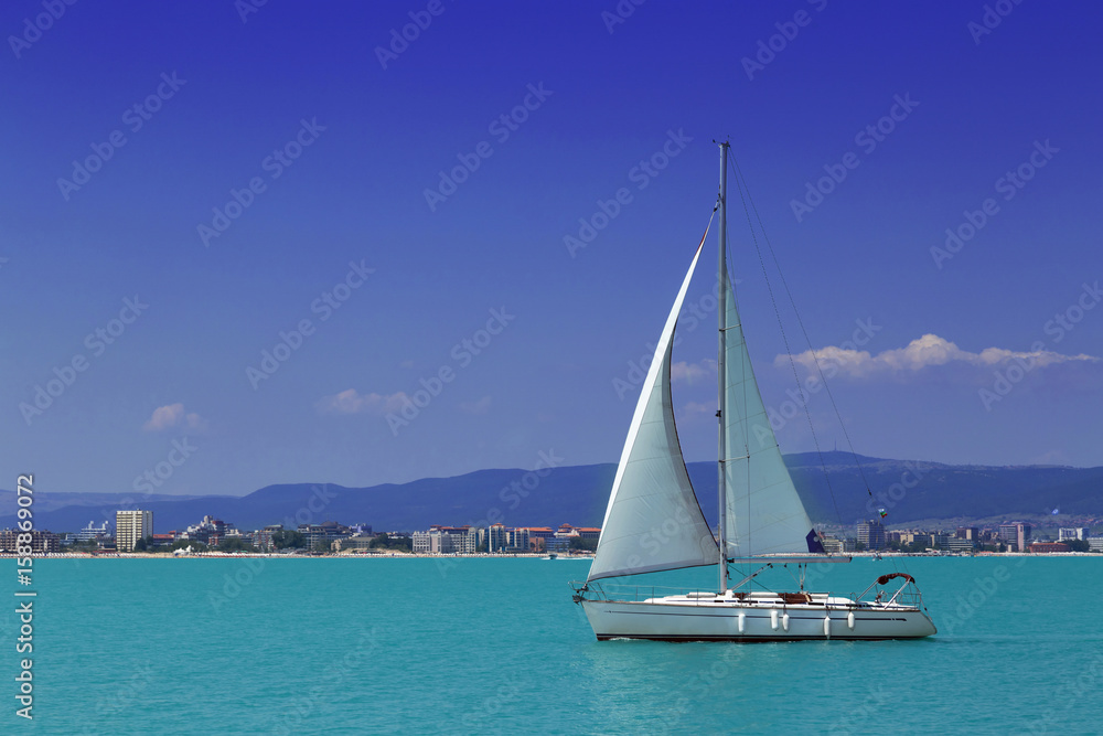 Sailing yacht in to the sea in summer
Sailing yacht in to the sea in summer