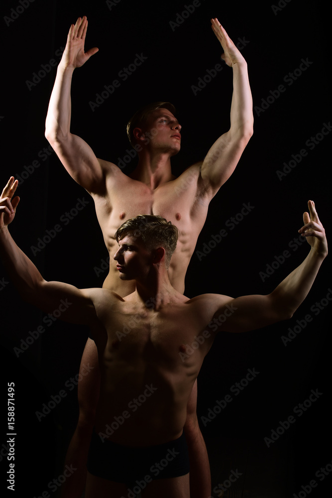 twins, muscular men with bare torso, six pack in underwear