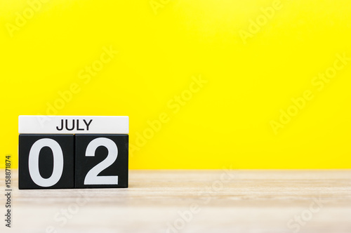 July 2nd. Image of july 2, calendar on yellow background. Summer time. With empty space for text