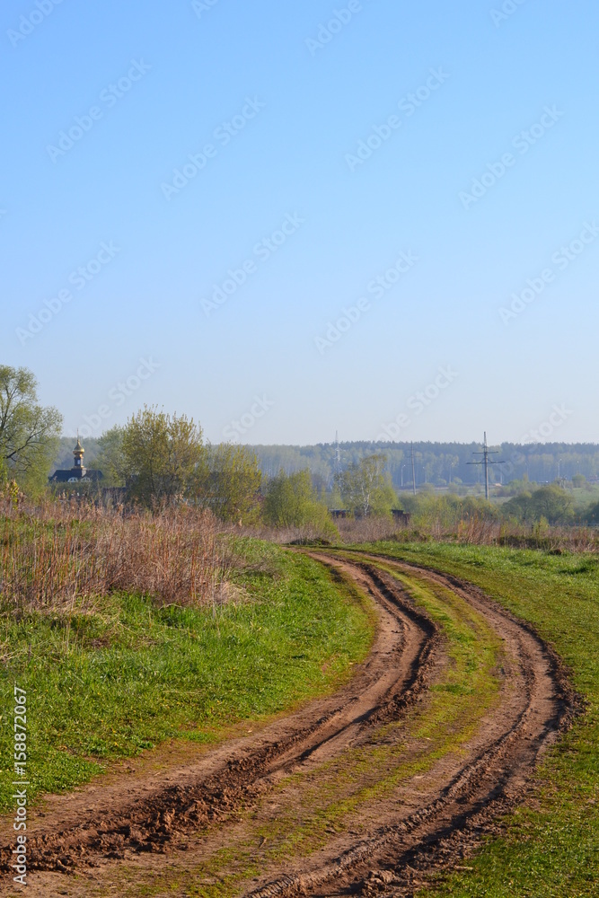 Russian rural landscape with empty dirt road