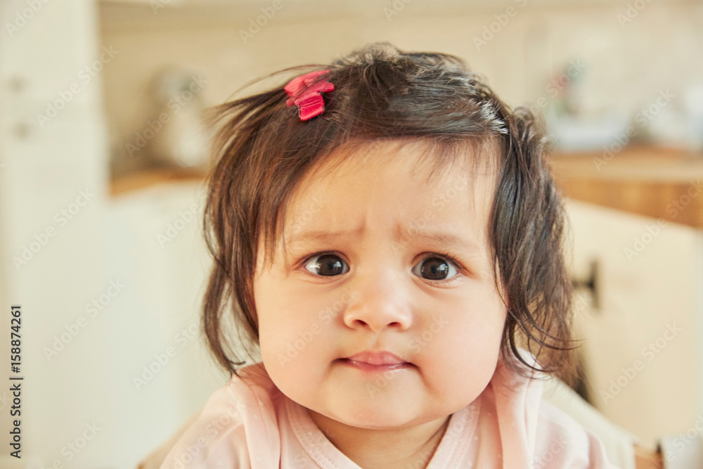 Portrait of cute baby girl pulling a face Portrait of cute baby girl pulling a face