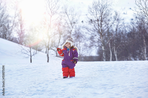 Portrait of young girl, standing in snowy landscape, Gjesdal, Norway photo