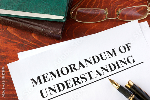 Photography Memorandum of understanding MOU on a table and a pen.
