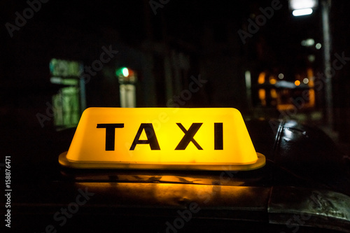 Illuminated taxi cab signage, Habana, Cuba photo