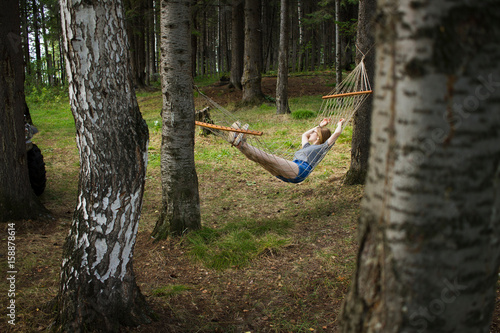 Woman resting in hammock, Nizny Tagil, Russia photo