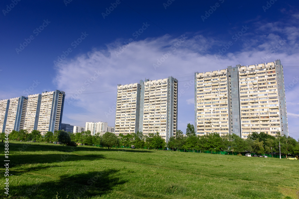 Beautiful high-rise city houses against the blue sky