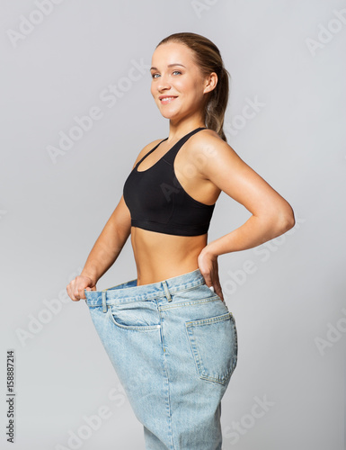 young slim sporty woman in oversize pants