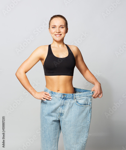 young slim sporty woman in oversize pants