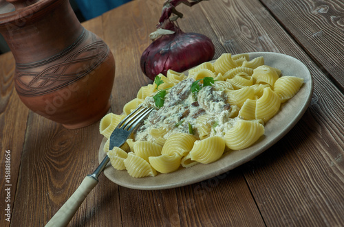 Italian pasta gomiti with mushroom sauce. photo