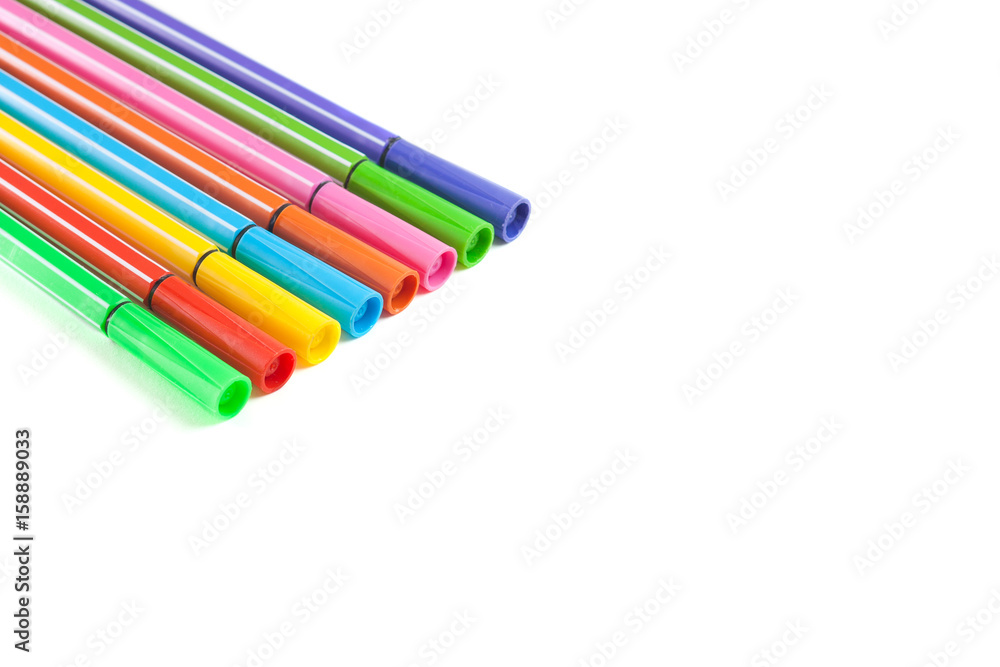 Fototapeta premium Multicolored markers lie on paper. Drawing. Writing goods 