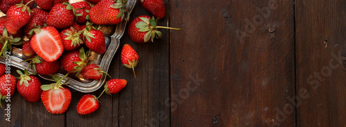 Strawberries  on a tray on a wooden table