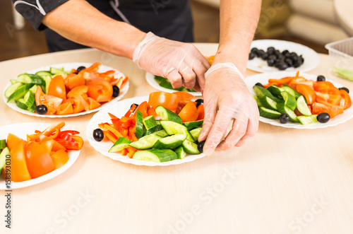 Close-up of chef cooking food kitchen restaurant cutting cook hands hotel man male knife preparation fresh preparing concept photo